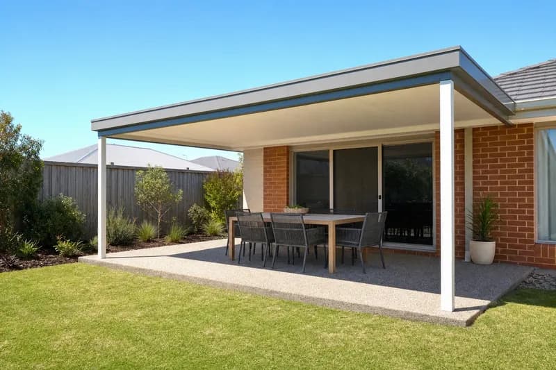 Flat roof patio over an outdoor dining setting on a red brick Perth home