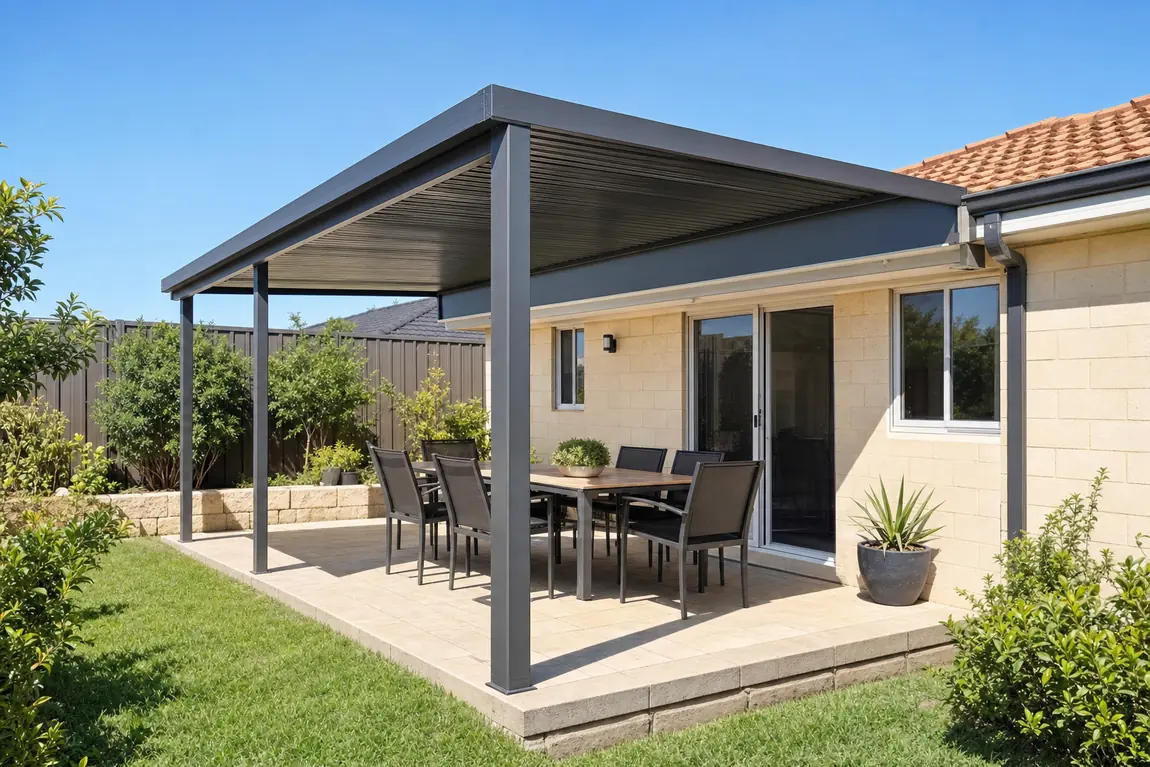 Charcoal raised flat patio joined above the gutter of a cream brick home with a tile roof
