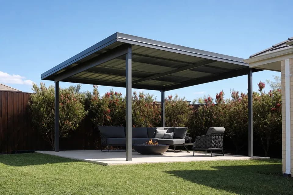 Skillion patio on four steel posts over an outdoor lounge and fire pit in a Perth backyard